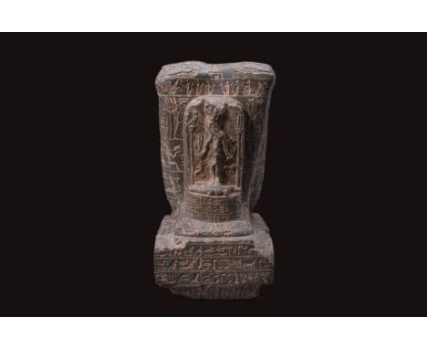 Early Ptolemaic Period, Ca. 304 - 200 BC. A black schist block statue, unfortunately, without the head. The figure is sculpte