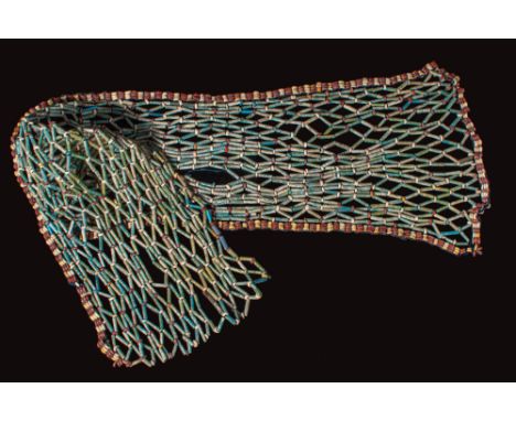 New Kingdom to Late Period, Ca. 1550 - 332 BC. A funerary bead net made from faience tubular beads interspersed with small ri