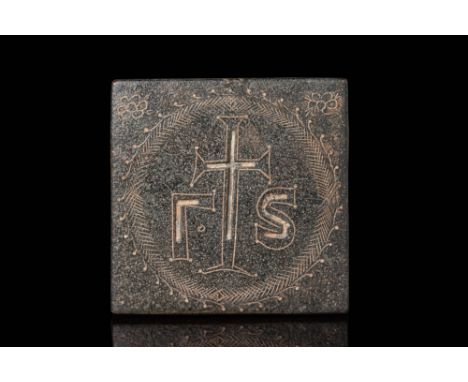 Ca. AD 400 - 500. A bronze weight engraved on the obverse with a central cross flanked by the Greek letters gamma (Γ) and sig