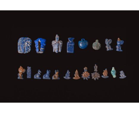 Ca. 1550 - 332 BC.A collection of 20 faience amulets, including a wedjat eye, stylised fruits, Bes figures with tambourines, 