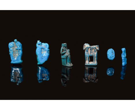 New Kingdom to Ptolemaic Period, Ca. 1550 - 30 BC. A group of six faience amulets in bright turquoise glaze. From left to rig