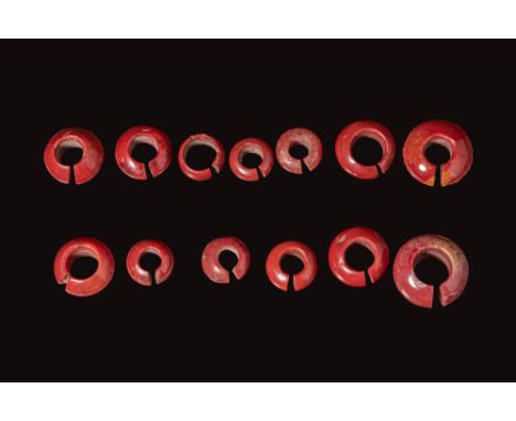 Late Period to Ptolemaic Period, Ca. 664 - 30 BC. A group of 13 penannular rings of varying diameter and thickness, each form