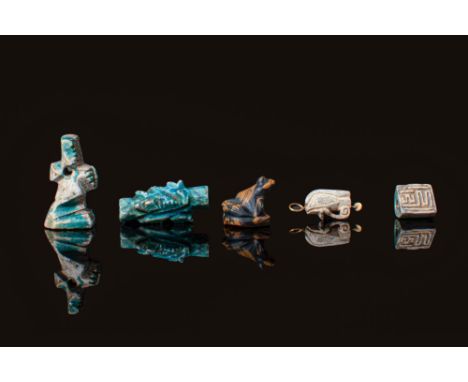 Late Period to Ptolemaic Period, Ca. 664 - 30 BC. A collection of five amulets. The one on the left is an amulet of the dwarf
