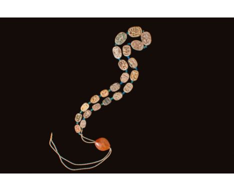 Middle Kingdom to New Kingdom, Ca. 2055 - 1550 BC. A strand of twenty-two steatite scarabs, each pierced longitudinally and e