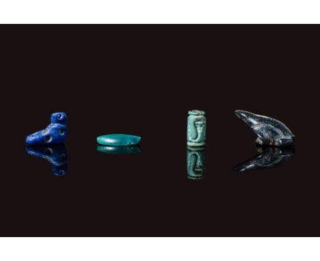 Middle Kingdom to the New Kingdom, Ca. 2055 - 1069 BC. A collection of three amulets. The one on the left is a foot-shaped am