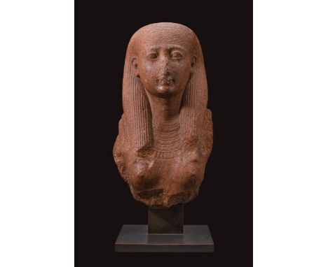 New Kingdom, 19th Dynasty, Reign of Sety I or early years of Ramesses II, Ca. 1290 - 1270 BC. A red granite bust depicting a 