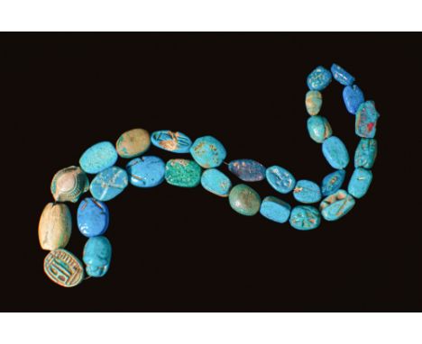 New Kingdom to Third Intermediate Period, Ca. 1550 - 664 BC. A strand of 30 blue-glazed composition scarabs, each pierced lon