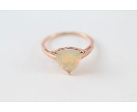 9ct rose gold trillion cut opal solitaire ring in a three claw setting (1.9g) 