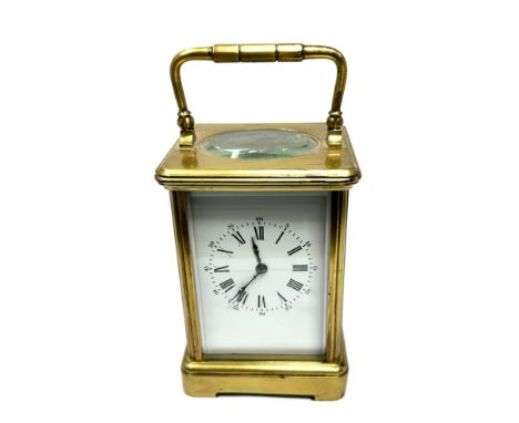 Large Vintage chiming brass carriage clock the clock is ticking measures approx height without handle 13cm high by 9cm wide 