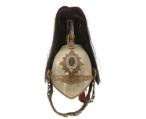 AN 1871 PATTERN FIRST ROYAL DRAGOONS TROOPER'S HELMET, the white metal skull with brass fittings, black horse hair plume, lea