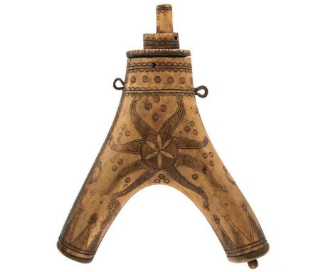 A LATE 17TH CENTURY OR 18TH CENTURY GERMAN OR POSSIBLY HUNGARIAN HORN POWDER FLASK, of characteristic Y form, profusely decor