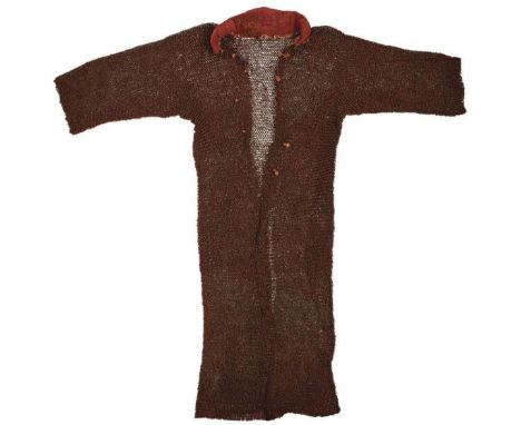 A 17TH CENTURY MUGHAL INDIAN MAIL SHIRT, the knee length short sleeved shirt with padded collar, composed of alternate rows o