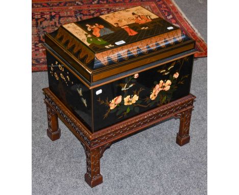 A modern Chinese lacquered robe chest on a Chinese Chippendale style carved stand, 53cm by 40cm by 62cm