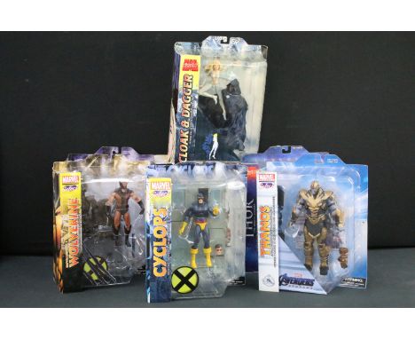 Seven carded Diamond Select Marvel Action figures featuring Starforce Captain Marvel, Brown Uniform Wolverine, Thanos, Cloak 