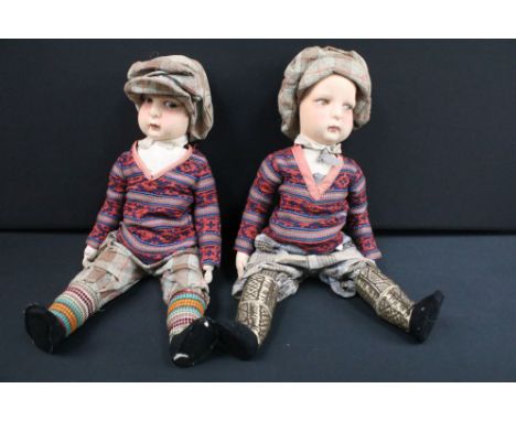 Two cloth / felt covered dolls in the Lenci style with painted faces, both dolls gazing to the left, in traditional national 