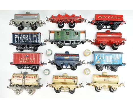 12 Hornby O gauge items of rolling stock to include Glass Lined Milk Dairies Milk Tank, Cadburys Chocolates Wagon, Jacob &amp