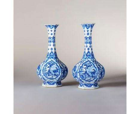Kangxi Period (1662-1722) Each with slender necks with flared rims and decorated with shaped panels set against a cracked-ice