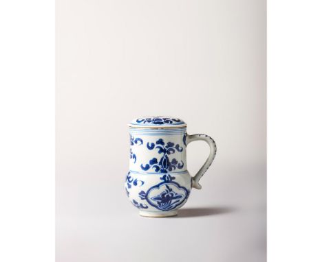 Kangxi Period (1662-1722) Potted with a globular body, a cylindrical neck, a S-shaped handle and with a slightly domed cover.