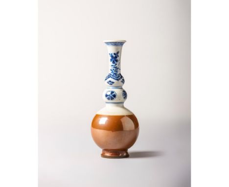 Qing Dynasty, first half of the 18th century Of triple gourd shape. The lower bulb with cafe au lait glaze and an horizontal 