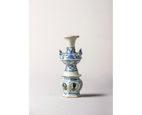 Yuan Dynasty (1271-1378) Modelled with two handles and a hexagonal base with six arched recesses.Height: 16,8 cmNote: Pieces 