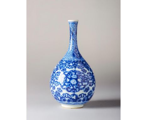 Kangxi Period (1662-1722) Of pear-shaped body and with a long slender neck. Decorated with flowers and four interlinked shape