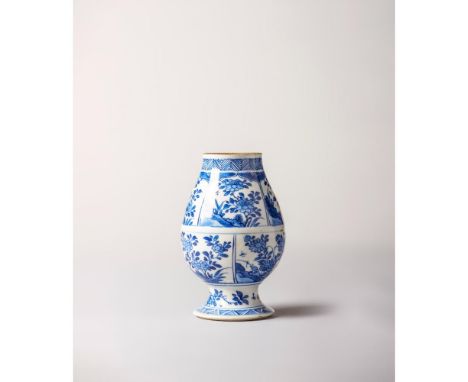 Kangxi Period (1662-1722) Raised on a splayed foot and painted with eight panels featuring flower compositions. Lip and foot 