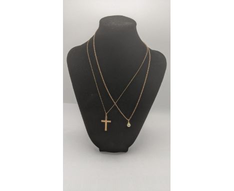 A 9ct yellow gold cross pendant on a 9ct gold chain together with a 9ct gold and pearl drop pendant on a yellow metal necklac