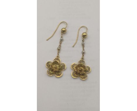 A pair of yellow metal and pearl daisy earrings having a pierced design 4.6g tested as 9ct yellow goldLocation:If there is no