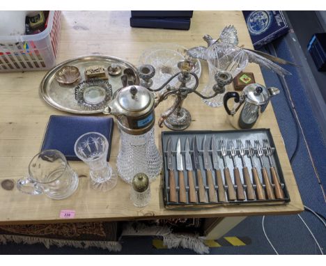 Silver plated items to include an oval tray, a claret jug, a candelabra, coffee spoon and tong set and other assorted glasswa