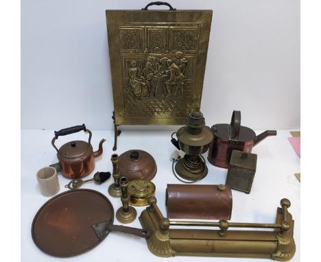 A group of fireside items to include a brass plated fire screen, two copper kettles, a copper footwarmer, a pair of compositi