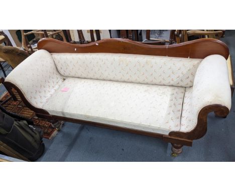 A Victorian mahogany sofa having scroll formed arms and on castors, 89.5H x 200WLocation: A3BIf there is no condition report,