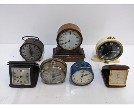 A group of travel clocks and vintage alarm clocks to include a Smith alarm clock with Arabic dial, an Imhof Swiss travel cloc