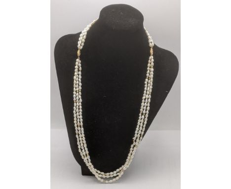 A three strand pearl and gold ball strand necklace having a double 14ct yellow gold catchLocation:If there is no condition re