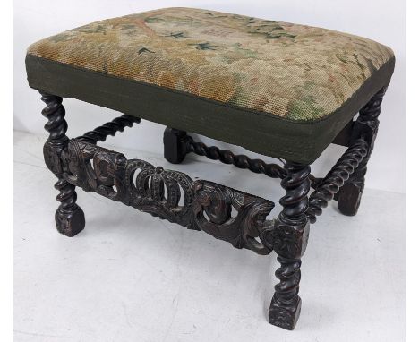An 18th century stool having a tapestry top, barley twist supports and pierced carved supports, 43cm h x 57cm wLocation: A1BI