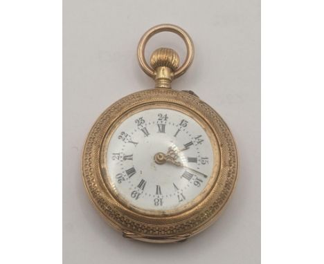 An 18ct yellow gold open faced keyless ladies fob watch having engine turned borders and engraved decoration 18.4g Location:I
