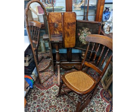 A mixed lot of furniture to include a swivel top table, a rocking chair, two mirrors and an embodied fire screen on a pole.Lo