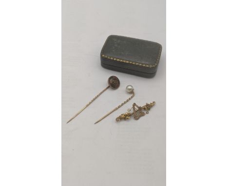 Yellow gold to include: a 9ct and pearl stick pin, a yellow metal and enamel stick pin tested as 9ct, bar brooch A/F tested 9