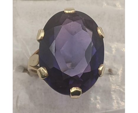 An oval cut faceted synthetic alexandrite and 9ct yellow gold ring, Size K, 7.3gLocation:If there is no condition report show