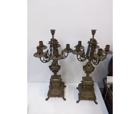 A pair of late 19th century gilt spelter candelabra with lion mask ring handles on paw feet.Location:If there is no condition