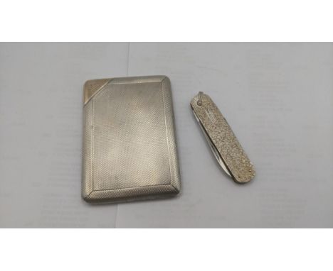 An engine turned silver cigarette case having a guilt interior engraved "D.R 1919" to the left hand corner, hallmarked London