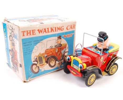 An original vintage ' Made In Japan ' battery operated tinplate ' Willy The Walking Car ' toy. Litho-printed tin construction