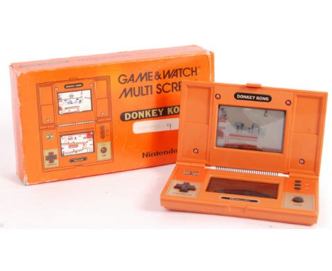 An original vintage Nintendo made ' Game &amp; Watch ' ' Donkey Kong ' handheld games console. The Game &amp; Watch itself&nb