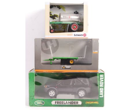 A collection of assorted scale precision diecast models to include; 1/18 Ertl Land Rover Freelander, 1/24 Schleich 42041 and 