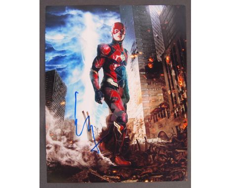 Ezra Miller - American Actor - an impressive photograph of Miller as ' The Flash ' in the DC Comics series. Autographed by Mi