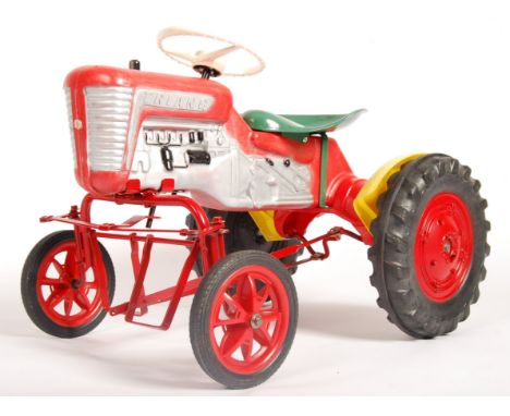 A charming original vintage 1960's Tri-ang / Triang made child's pedal car ' Tractor '. Plastic body in red, with silver pain