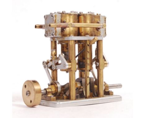 A charming vintage small live steam model engine (likely from a boat). Two-cylinder, and appearing in working order and well 