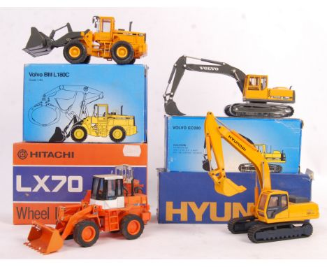 A collection of 4x assorted scale diecast model construction vehicles to include; 1/50 scale Kingstar Toy made Hyundai Rolex 