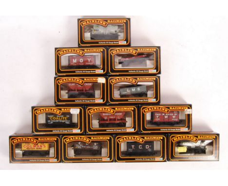 A collection of 12x original vintage Palitoy made Mainline Railways 00 gauge model railway train set rolling stock wagons to 