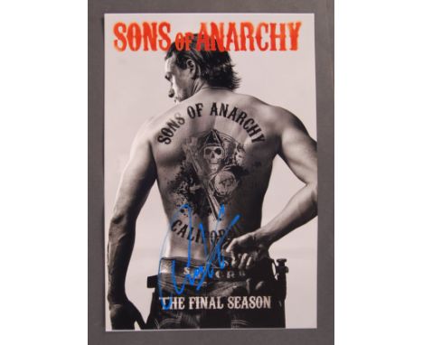 Charlie Hunnam - English Actor - fantastic 16x12" poster photograph from ' Sons Of Anarchy '. Signed by Hunnam in blue paint 
