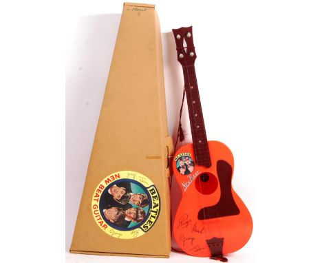 An incredible condition rare vintage 1960's (1964) Selcol made The Beatles ' New Beat ' plastic acoustic model guitar. Burgun